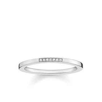 Silver diamond band ring with seven small diamonds.
