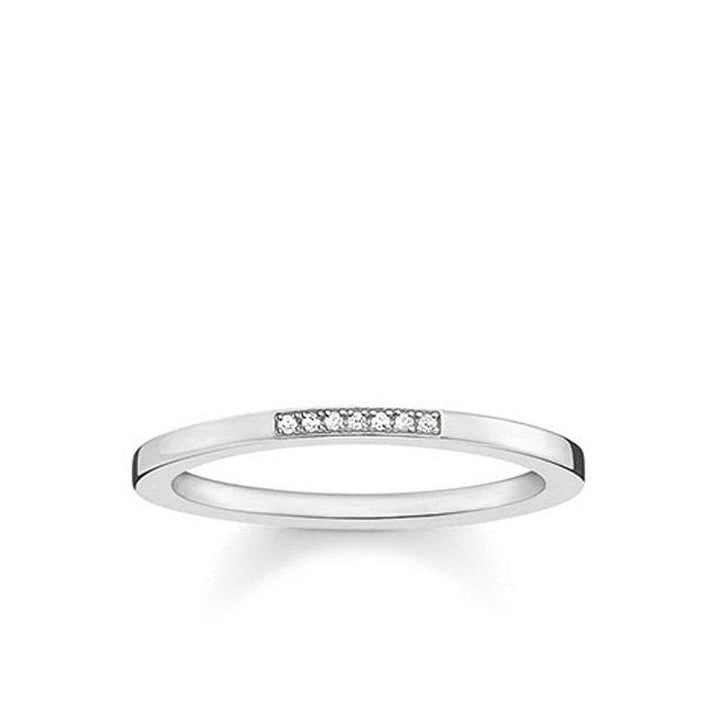Silver diamond band ring with seven small diamonds.
