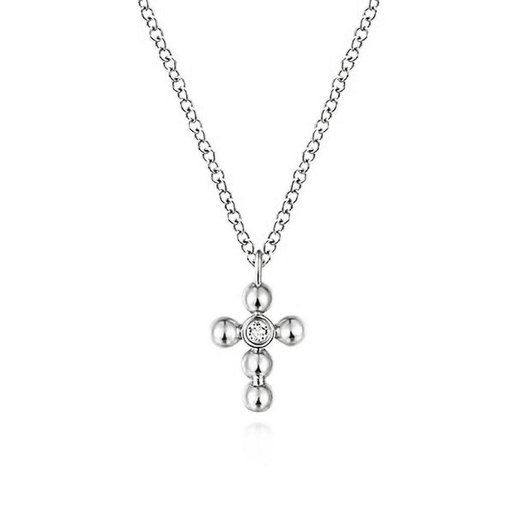 White gold diamond cross necklace with beaded detail.
