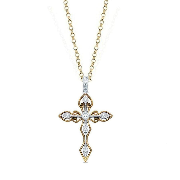 Diamond Cross pendant necklace in yellow and white gold with intricate detailing.
