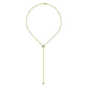 Long gold lariat necklace featuring a diamond-encrusted pendant.
