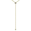 Gold diamond lariat necklace with two small pave diamond accents.
