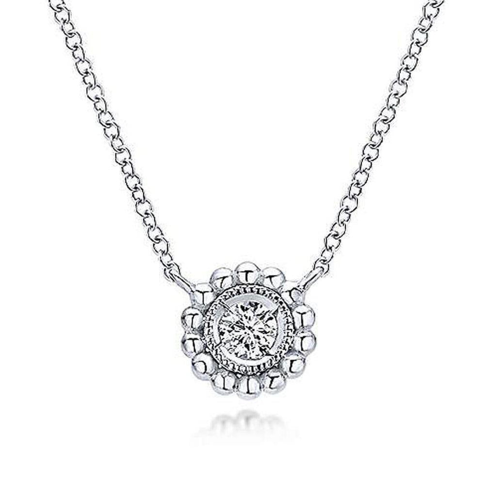 Elegant beaded diamond pendant necklace with solitaire center stone.
