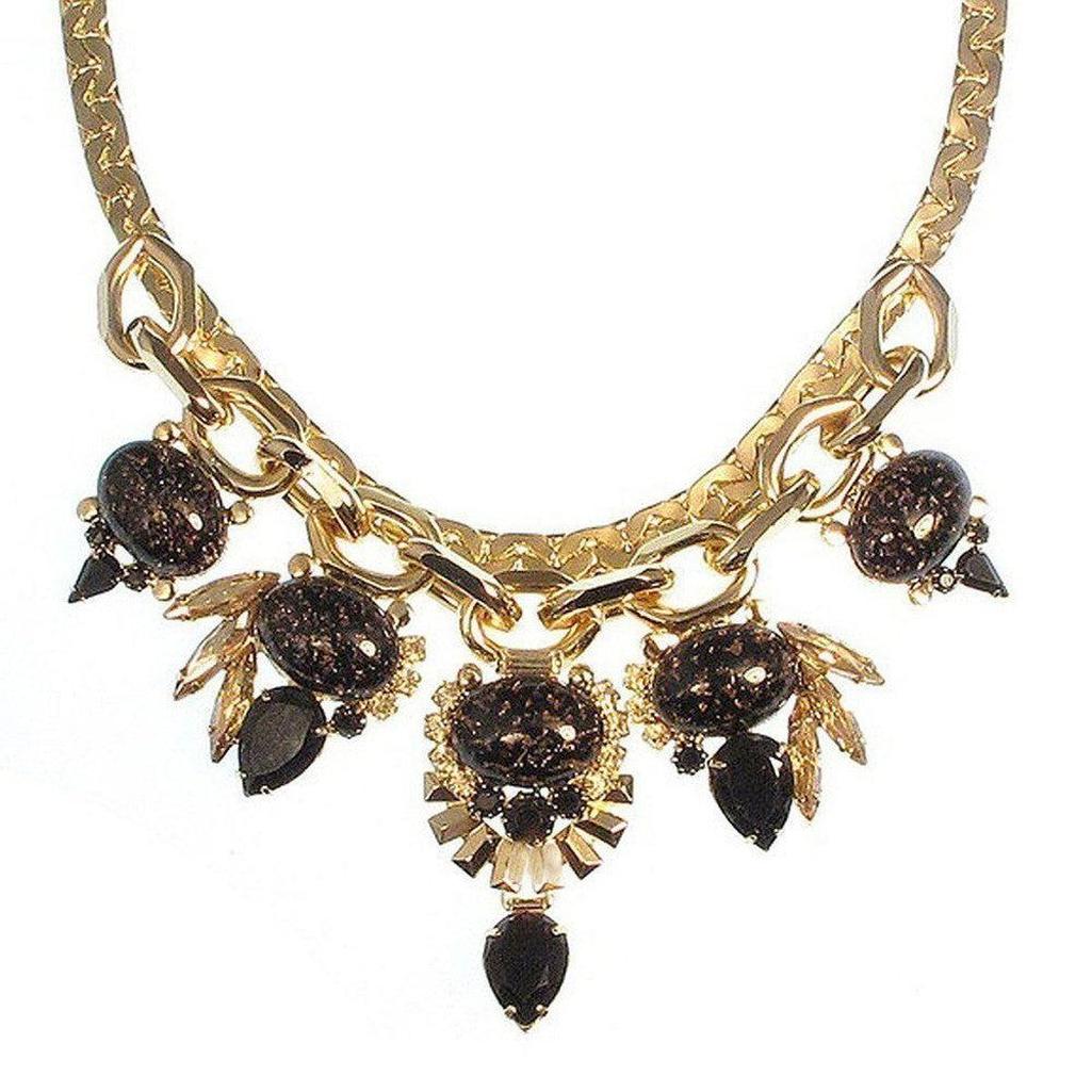 Dominique Necklace: Jet and gold statement necklace with dark stone accents.
