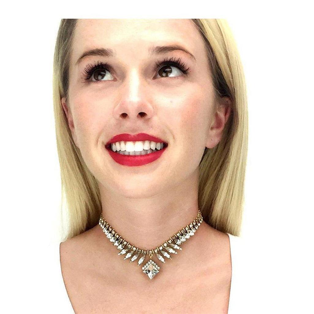 Sparkling crystal choker necklace with gold accents, shown on model.
