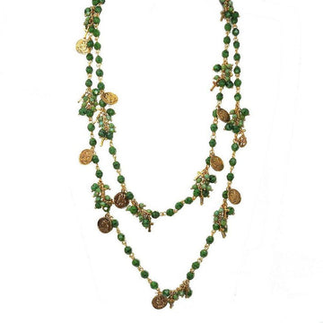 Double-strand green bead necklace with gold charms and crosses.
