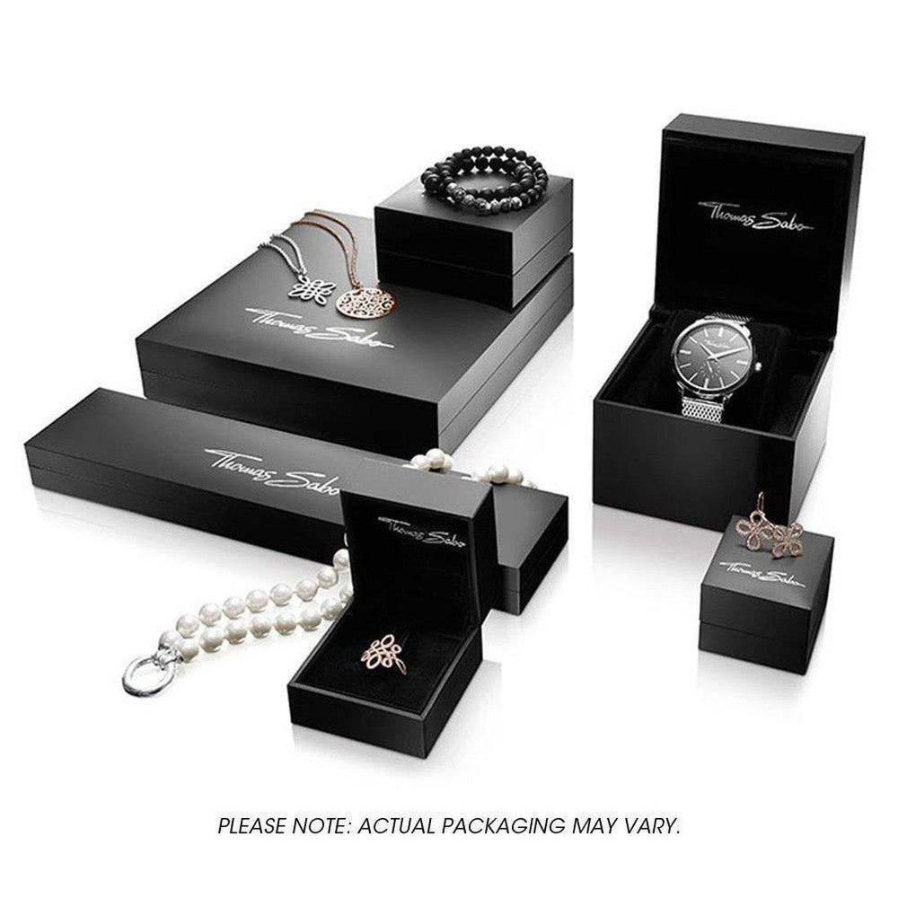 Elegant jewelry presentation in black gift boxes.
