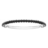 Engravable black onyx bead bracelet with silver skull accents and ID plate.
