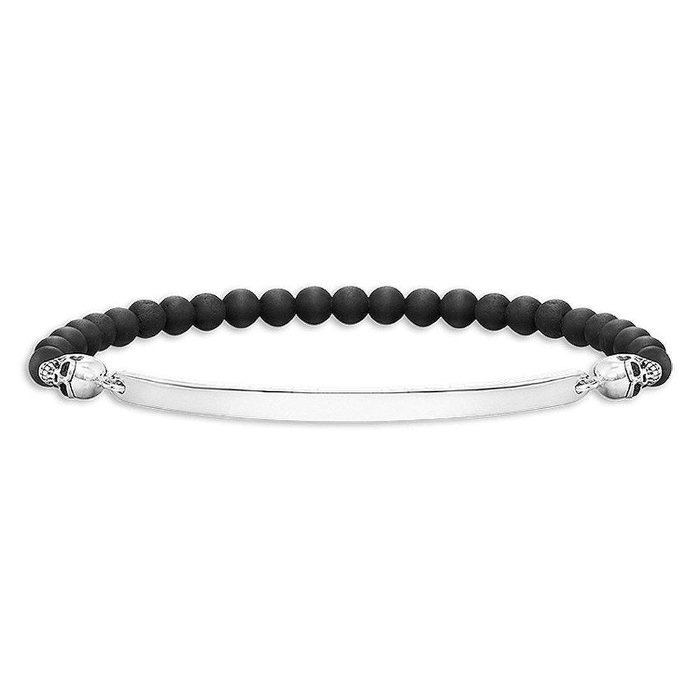 Engravable black onyx bead bracelet with silver skull accents and ID plate.

