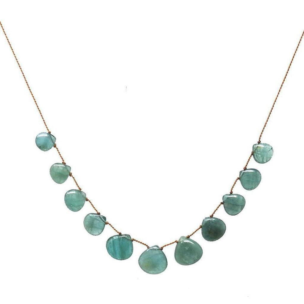Teal gemstone necklace on brown cord, featuring teardrop-shaped stones.
