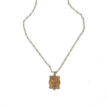 Gold four-way medal pendant on a delicate crystal rosary chain.
