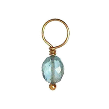 Aqua gemstone pendant with gold wire accents.
