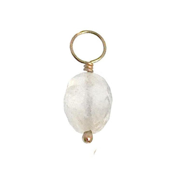 White gemstone charm with gold wire and loop for jewelry making.
