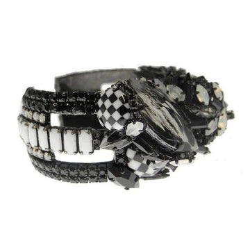 Black and white jeweled cuff bracelet featuring checkerboard and rectangular accents.
