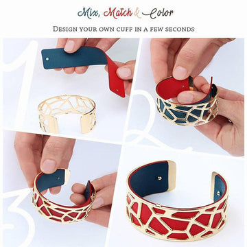 Gold metal cuff bracelet with red and navy leather inserts,  geometric design.
