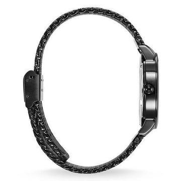 Black mesh band watch with a round face, shown from the side.
