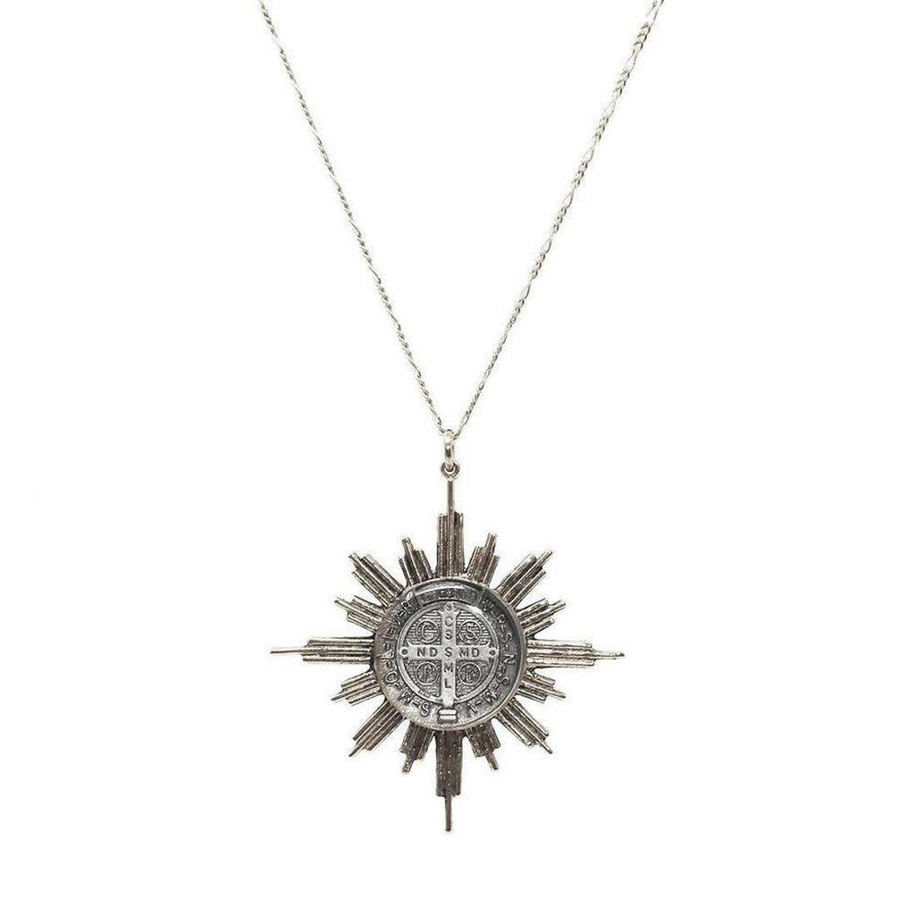 Glorious 34" Cartier necklace featuring a silver sunburst pendant with a detailed medal.
