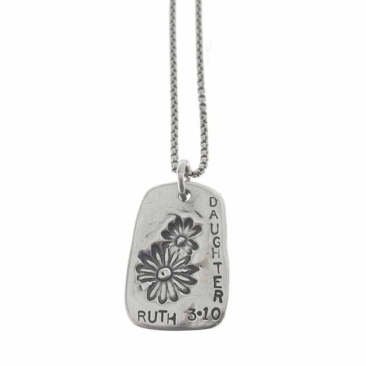 Silver necklace featuring a rectangular pendant with floral etching and "Daughter Ruth 3:10" inscription.
