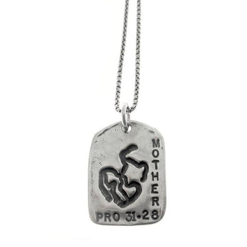God Tag Mother necklace: silver, rectangular pendant with "MOTHER" and "PRO 31-28" engraving, featuring a unique design.
