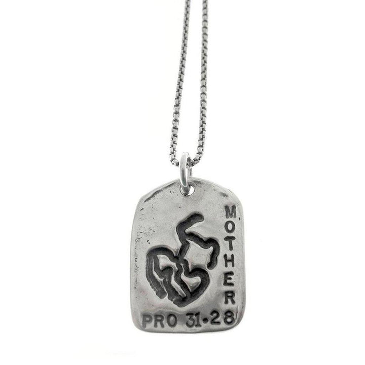 God Tag Mother necklace: silver, rectangular pendant with "MOTHER" and "PRO 31-28" engraving, featuring a unique design.
