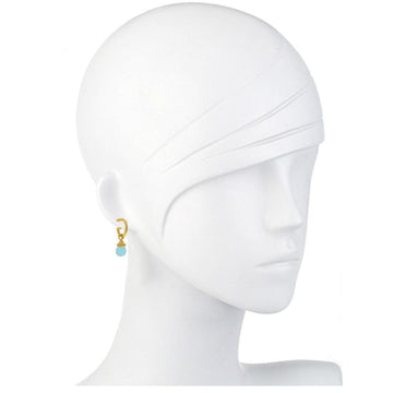 Gold hoop earrings featuring a light blue aqua quartz drop; displayed on a mannequin.
