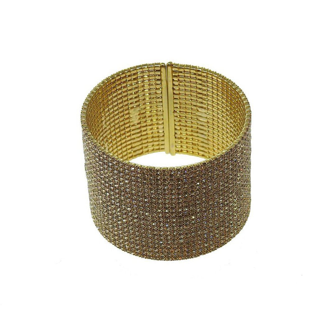 Gold cuff bracelet adorned with sparkling crystals.
