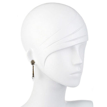Elegant gold and crystal drop earrings displayed on a white mannequin.
