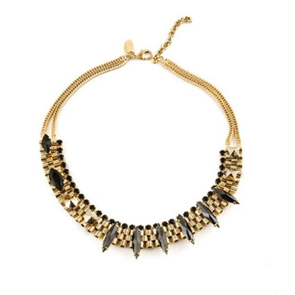 Gold and brass necklace with black stones; statement piece featuring geometric design.
