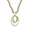 Gold and silver double oval drop necklace with gold bead chain.
