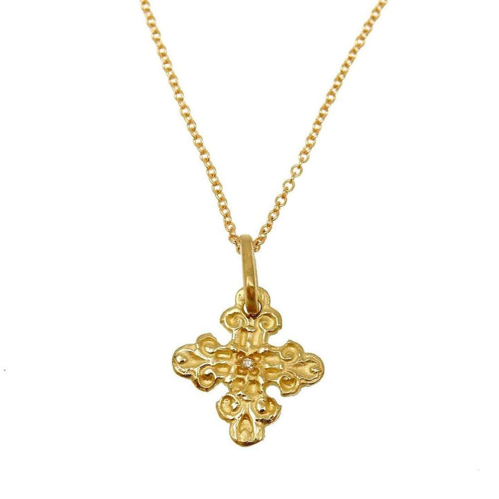 Gold Gothic cross necklace with tiny diamond accent
