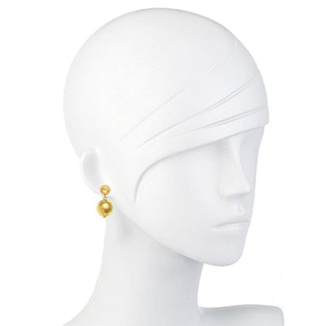 Gold-plated double ball dangle earrings on a mannequin.
