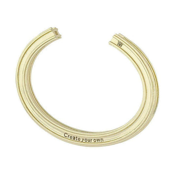 Gold-toned customizable bracelet; grooved design, engraved with "Create your own."
