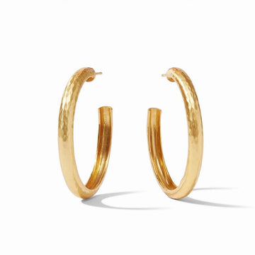 Gold hammered hoop earrings, shown against a white background.
