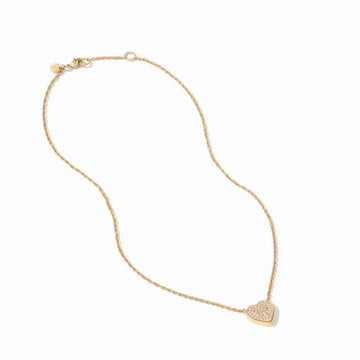Gold necklace with pave heart pendant on white background

