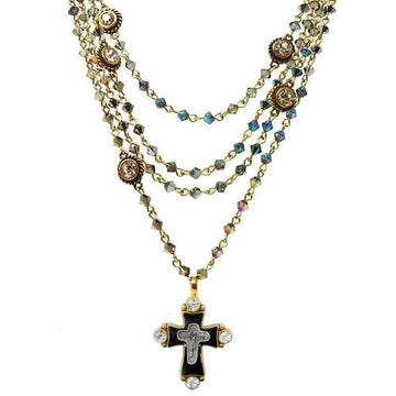 Hombre Bicone Magdalena necklace: multi-strand gold chain with iridescent crystals & black cross pendant.

