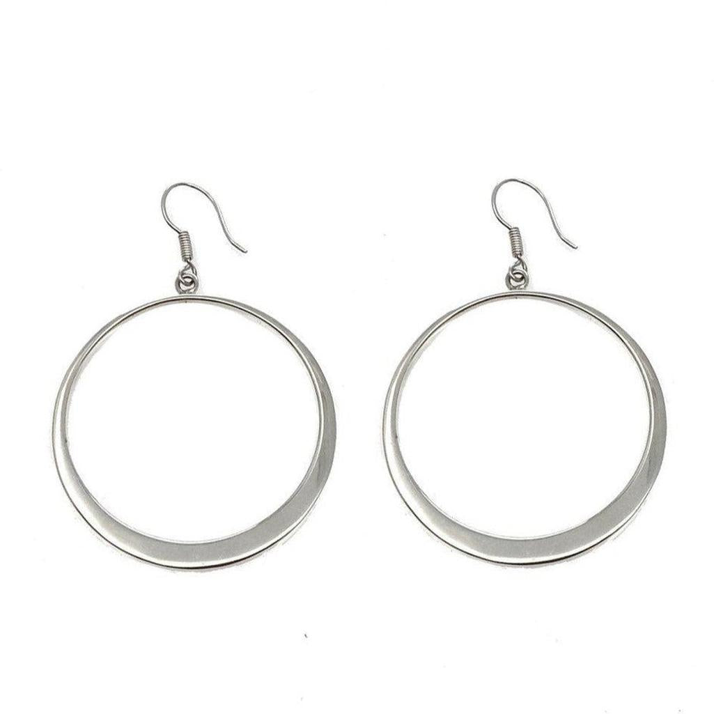 Silver hoop earrings with wire; modern, minimalist design.
