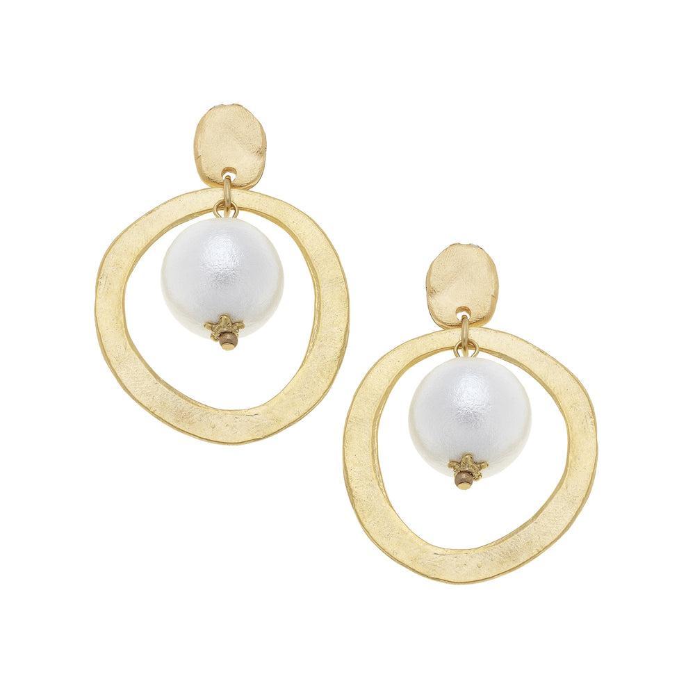Gold hoops earrings with a white pearl
