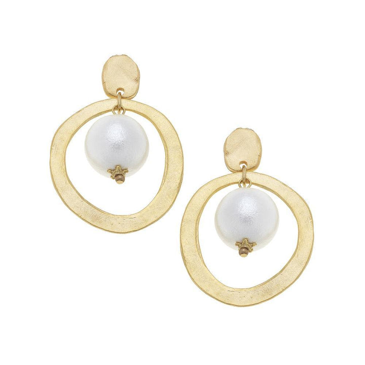 Gold hoops earrings with a white pearl

