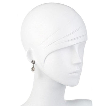 Elegant silver drop earrings with pearl accents, shown on a mannequin.
