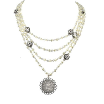 Multi-strand pearl necklace with silver accents and a coin pendant.
