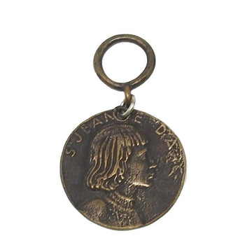 Bronze medallion featuring Joan of Arc profile.
