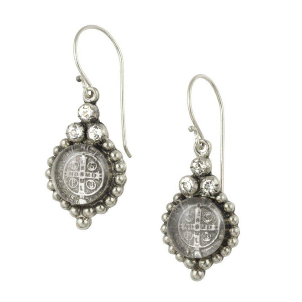Silver drop earrings featuring a clear glass medallion with an antique-style design and clear cubic zirconia accents.
