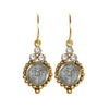 Joanna San Benito gold earrings with St. Benedict medallions and clear cubic zirconia accents.
