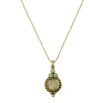 Gold ball chain necklace with a detailed circular pendant featuring pale green stones and an etched design.

