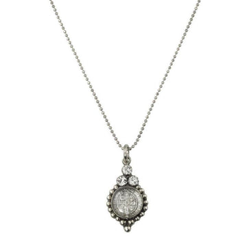 Silver necklace with a detailed pendant featuring clear stones and a religious medal.
