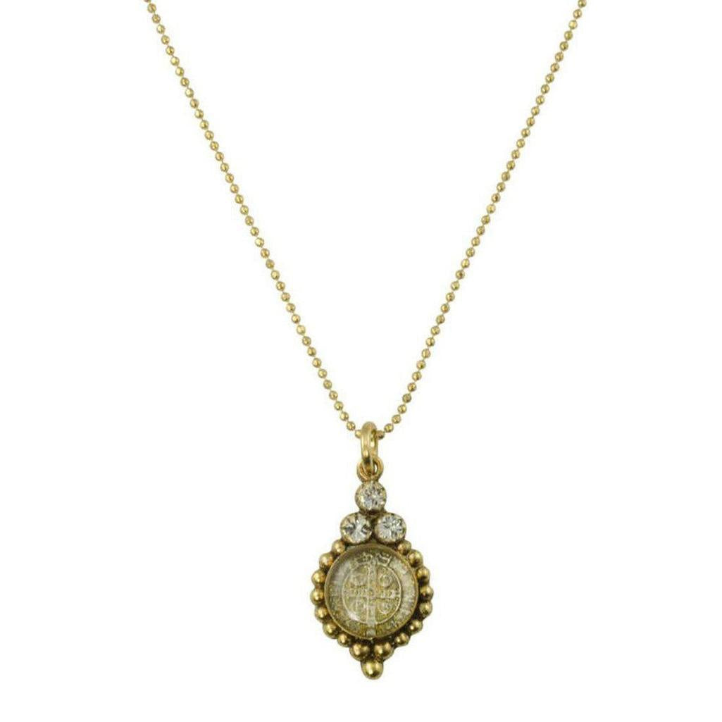 Joanna San Benito Necklace: Gold chain, clear crystal accents, antique gold medallion pendant.
