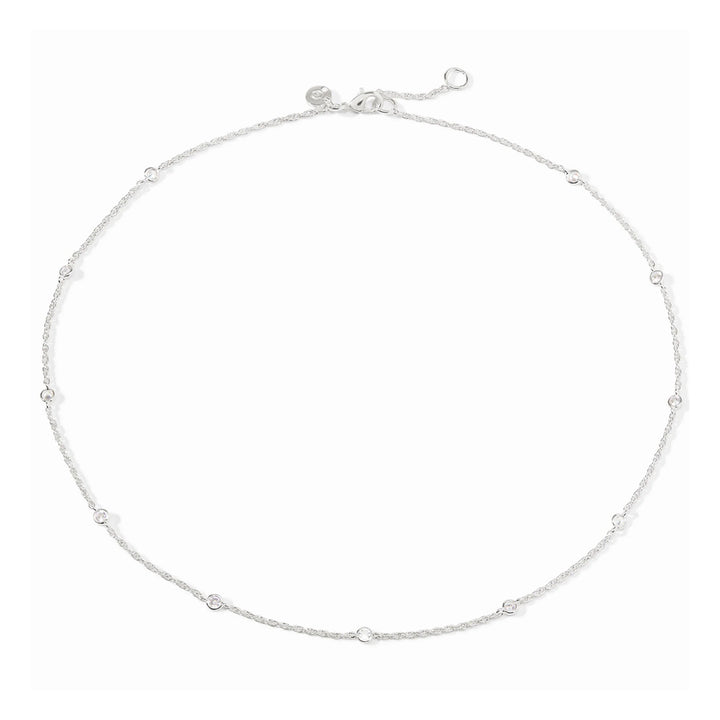 Silver-plated delicate station necklace featuring round bezel-set cubic zirconia crystals on an adjustable chain.