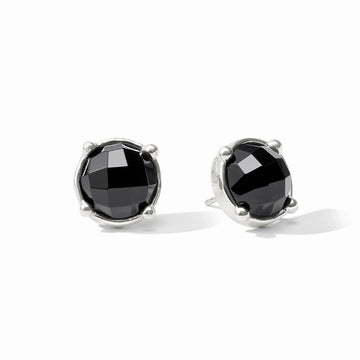 A pair of silver stud earrings featuring round black faceted gemstones in a prong setting, shown on a clean white background.