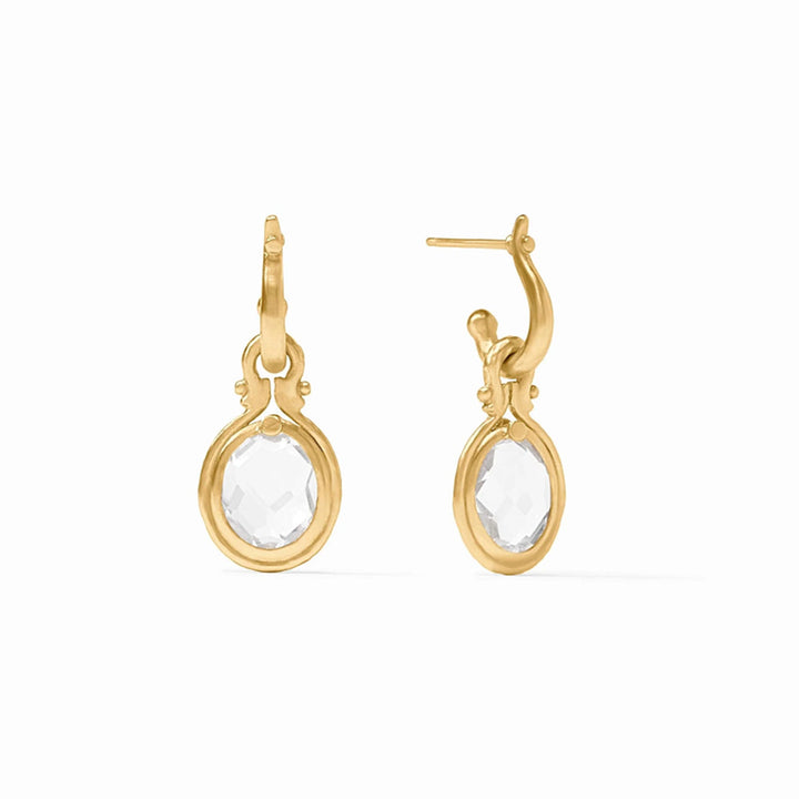 Saratoga huggie hoop earrings in 24K gold plate featuring oval imported glass crystal charms.