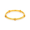 Medium Savannah stacking bangle in 24K gold plate with a textured hammered design and smooth accent beads.